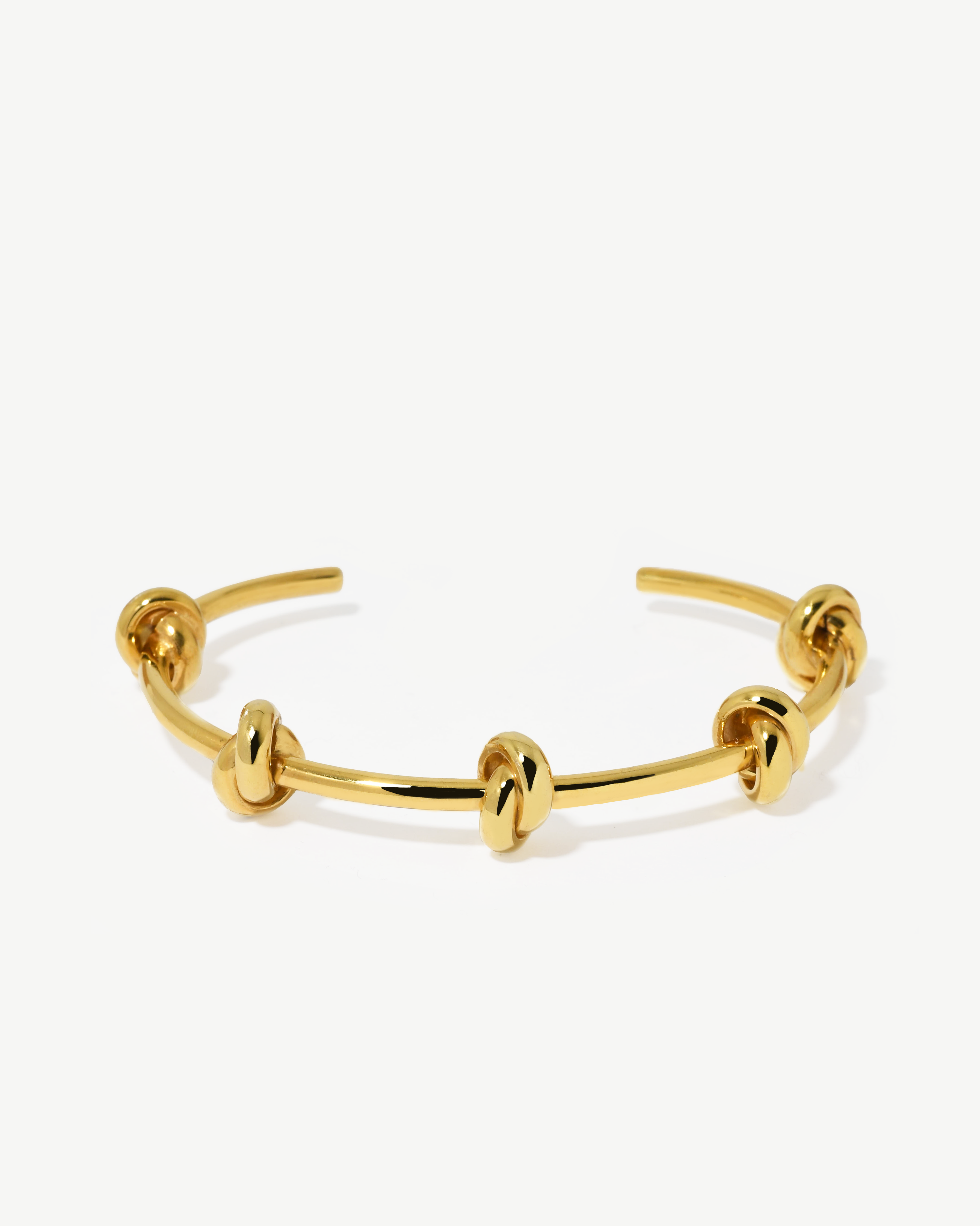 Escrava com nós statement de prata dourada.