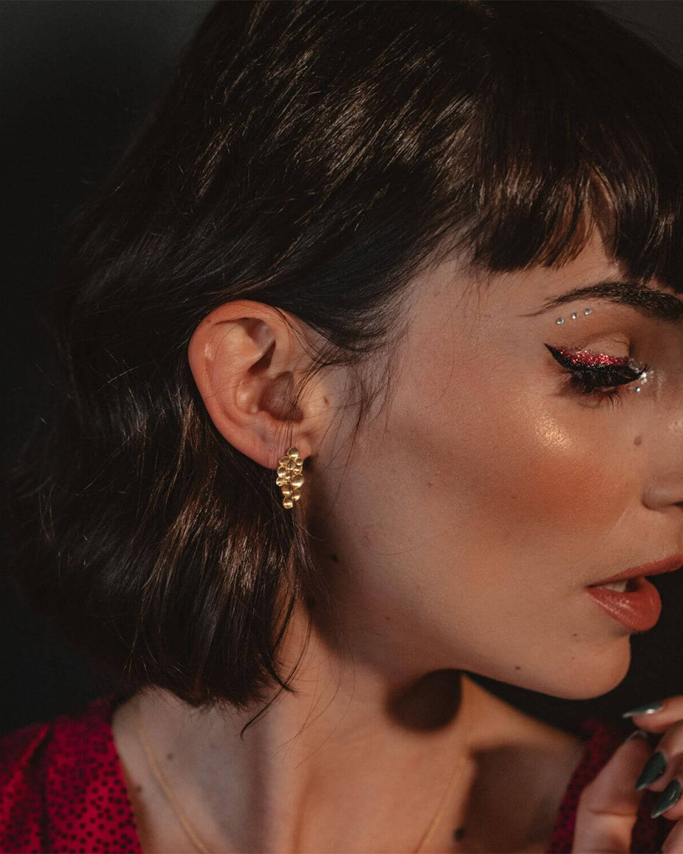 Brincos relevo dourados